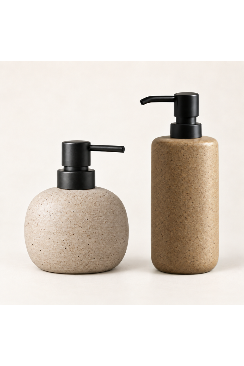 Two LUMI ceramic bath dispenser colour options, stone beige and muted ochre-brown, each with a matte black pump