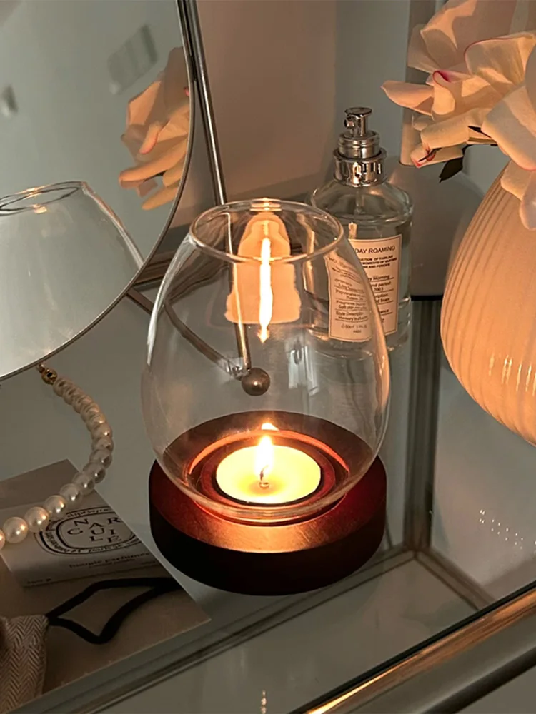 LUMERA glass and wood candle holder in use